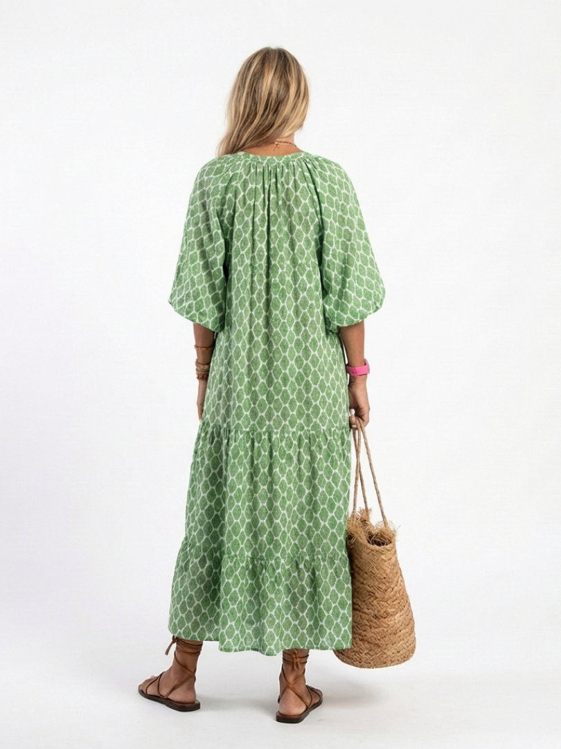 Apolline patterned midi dress in green, back view