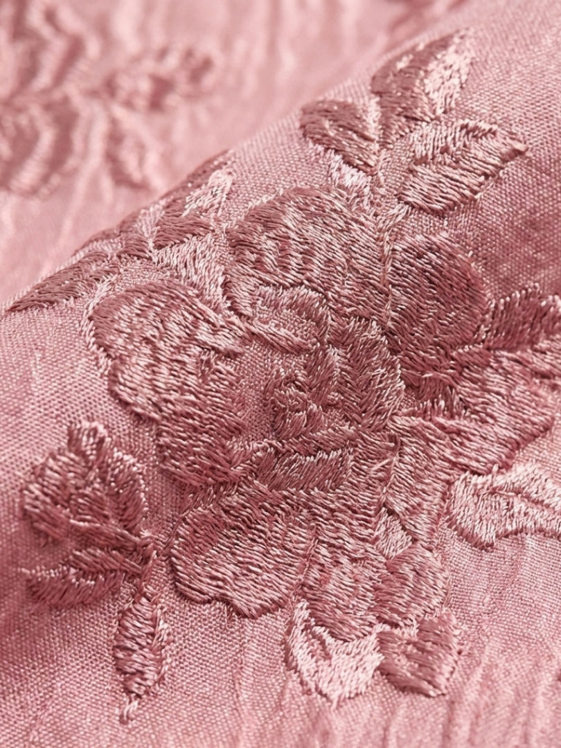Close-up of the raised floral texture on the Xanthea pink dress