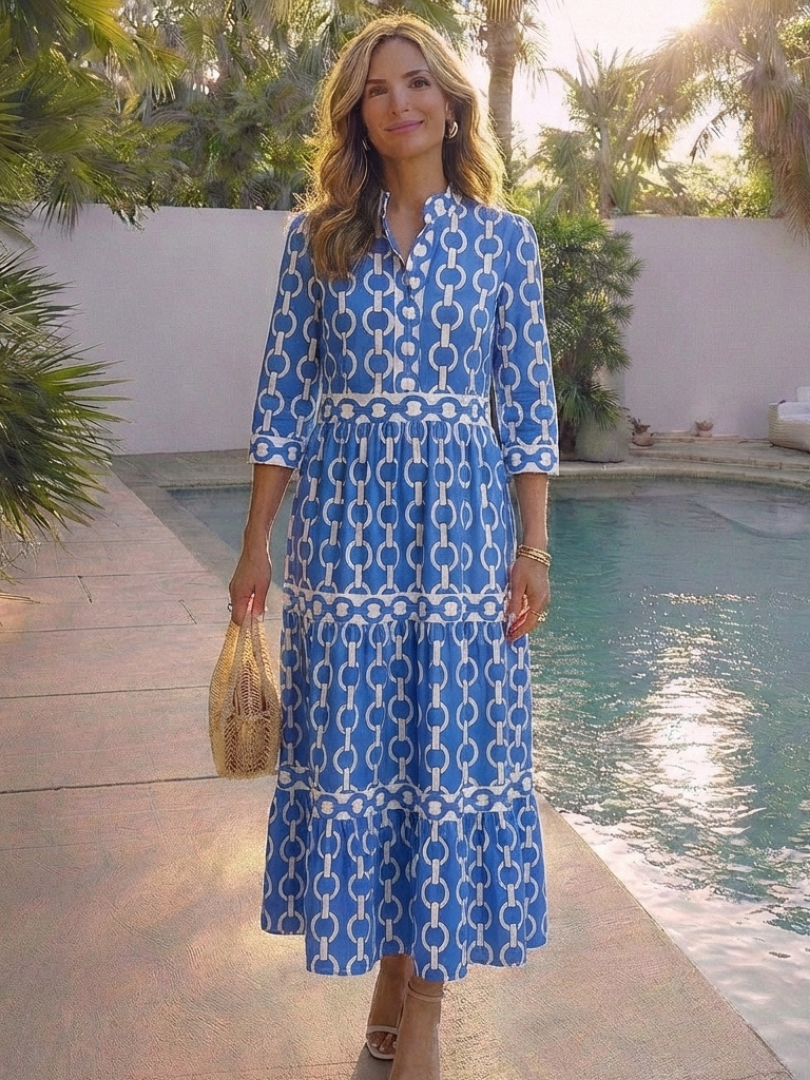 Ysolde chain pattern midi dress in blue, styled poolside with straw bag