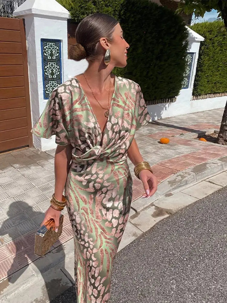 Clarandra copper midi dress in green print, close front view with deep V neckline