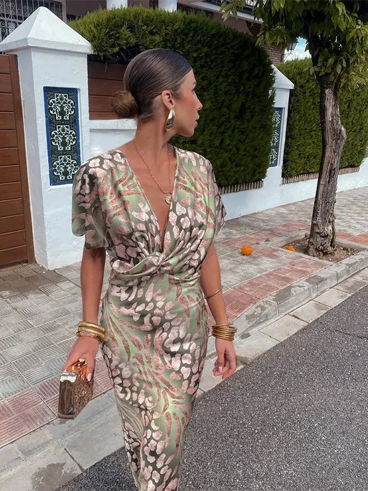 Clarandra copper midi dress in green print, side view walking