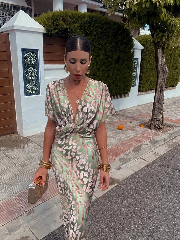 Clarandra copper midi dress in green print, front view with twisted waist knot
