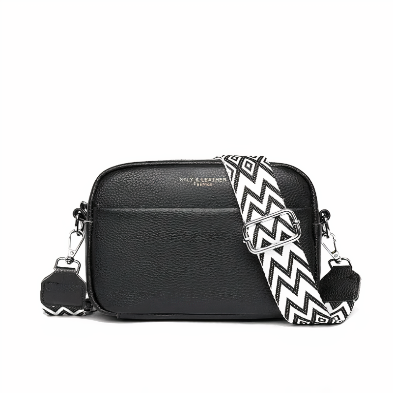 Serena luxe shoulder bag in black with white zigzag strap, front view