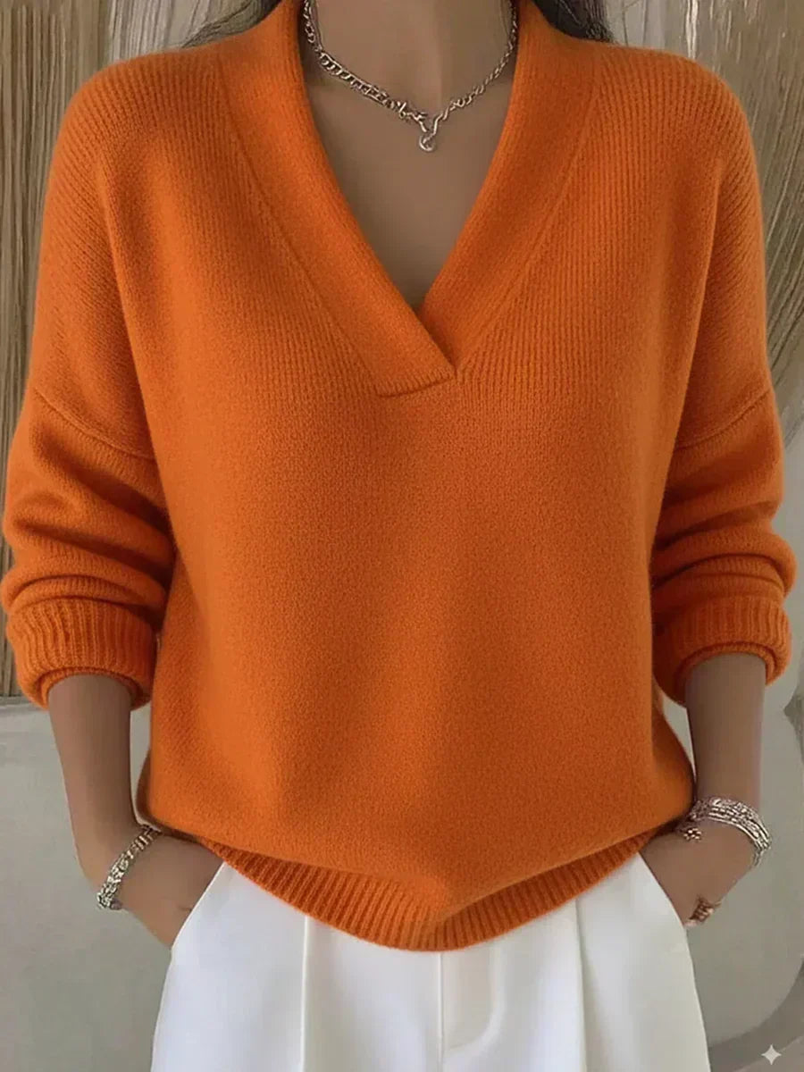 Violeta relaxed V-neck jumper in orange, front view on model