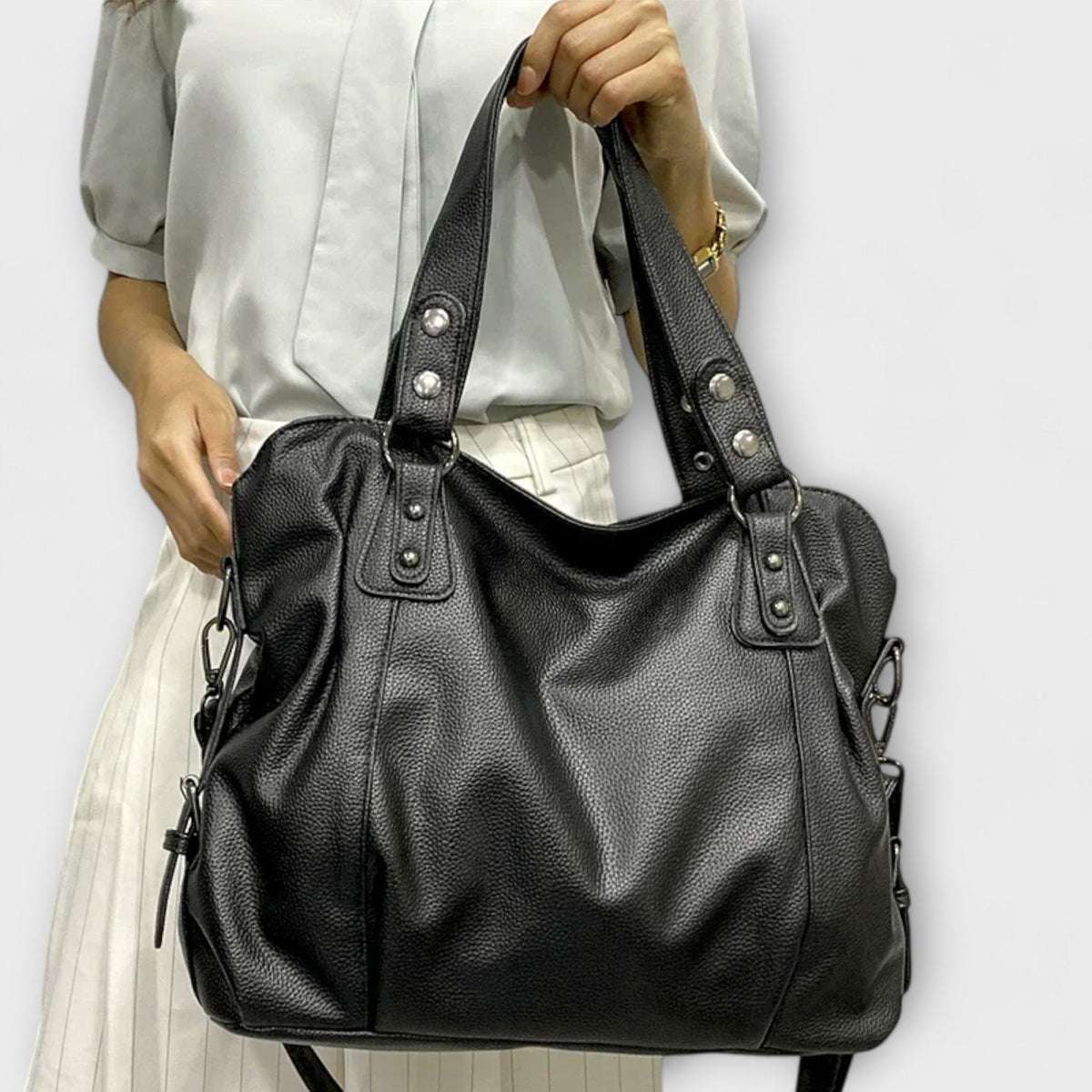 Bellefort Paris hobo shoulder bag in black held by the top handles