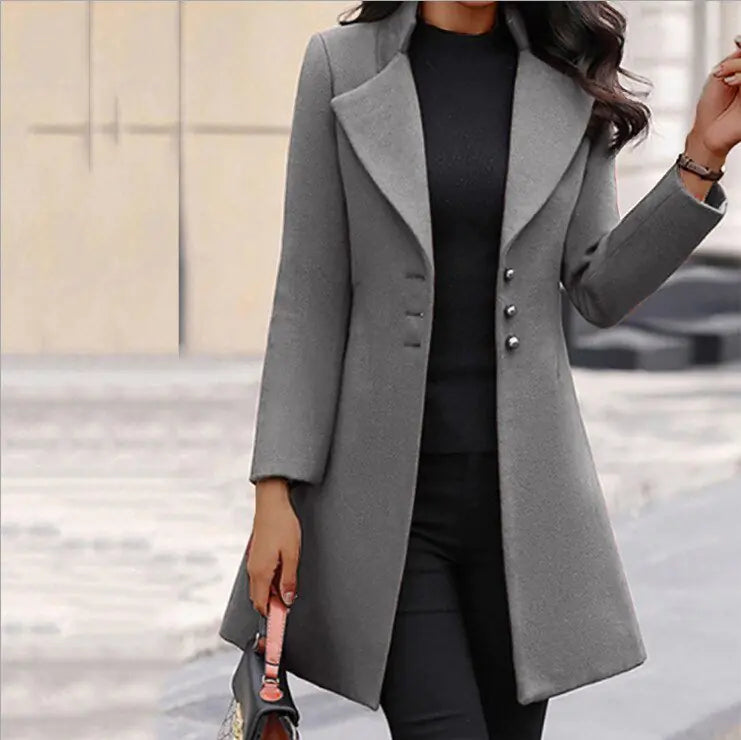 Oliviane long coat in light grey, worn open over black outfit