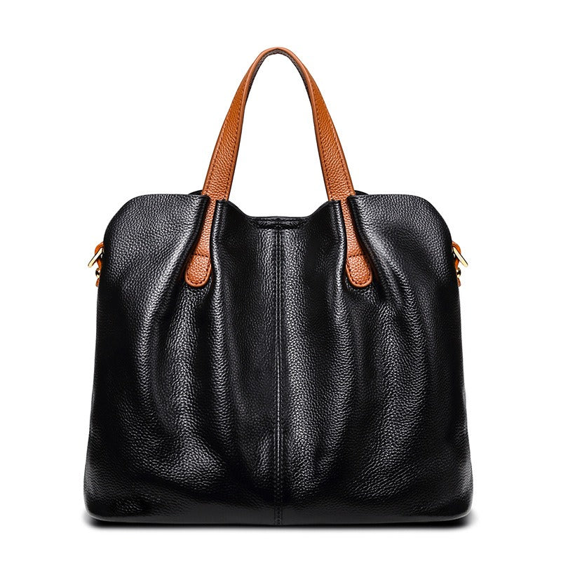 Alana tote bag in black with tan handles, front view