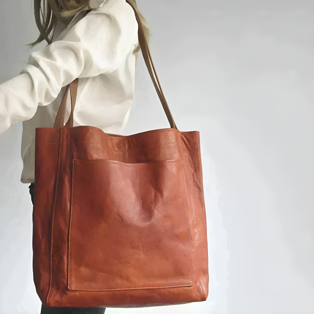Maisie urban handbag in brown carried on the shoulder