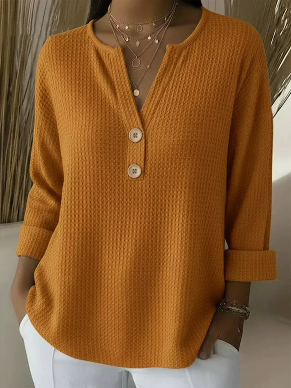 Lucía textured Henley top in orange, front view