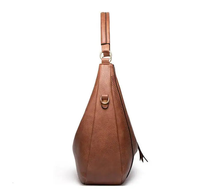 Ysolde leather hobo bag in brown, side profile view
