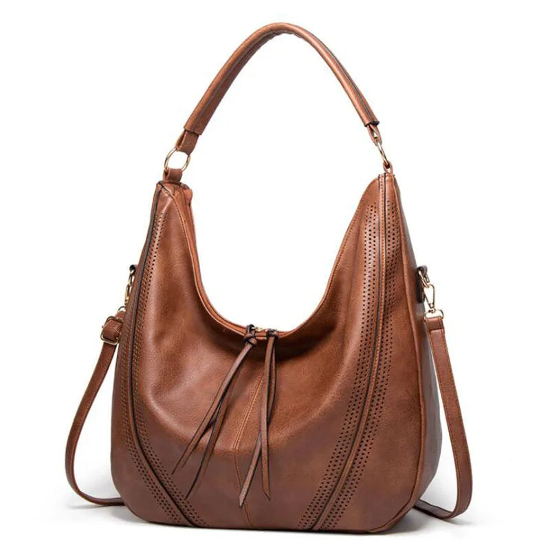 Ysolde slouchy leather hobo bag in brown, front view with tassel ties