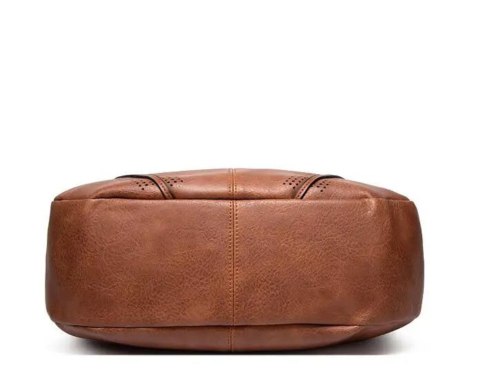 Ysolde leather hobo bag in brown, stitched base view
