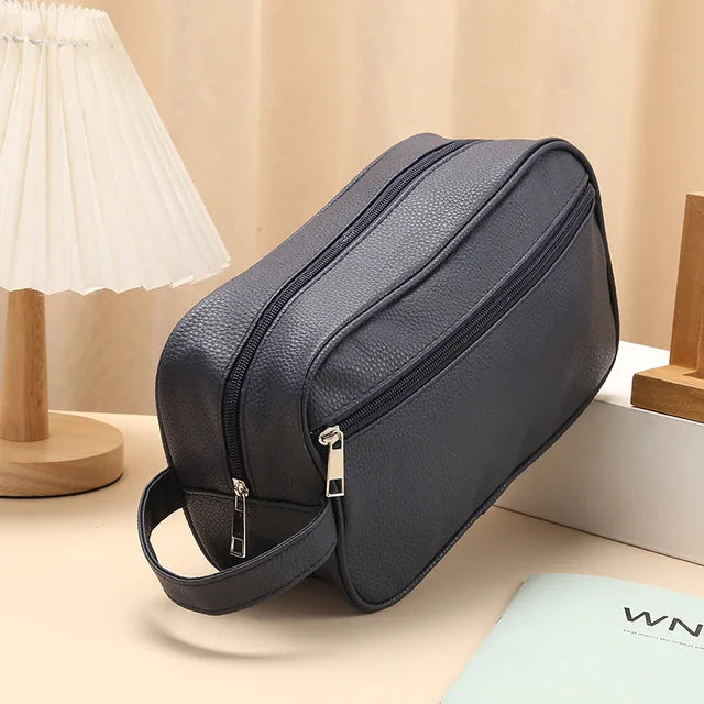 Anwen toiletry bag in blue, front three-quarter view