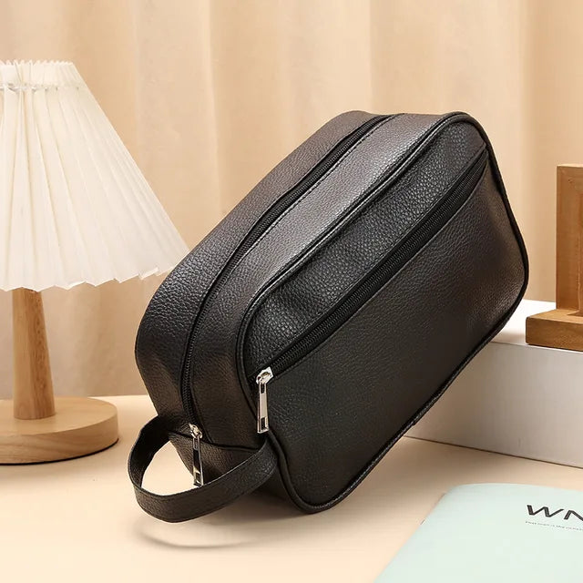Anwen toiletry bag in black, front three-quarter view