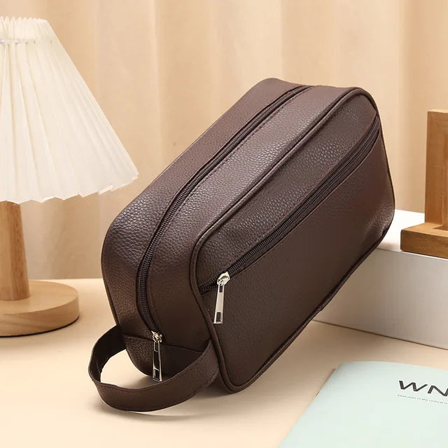 Anwen toiletry bag in brown, front three-quarter view