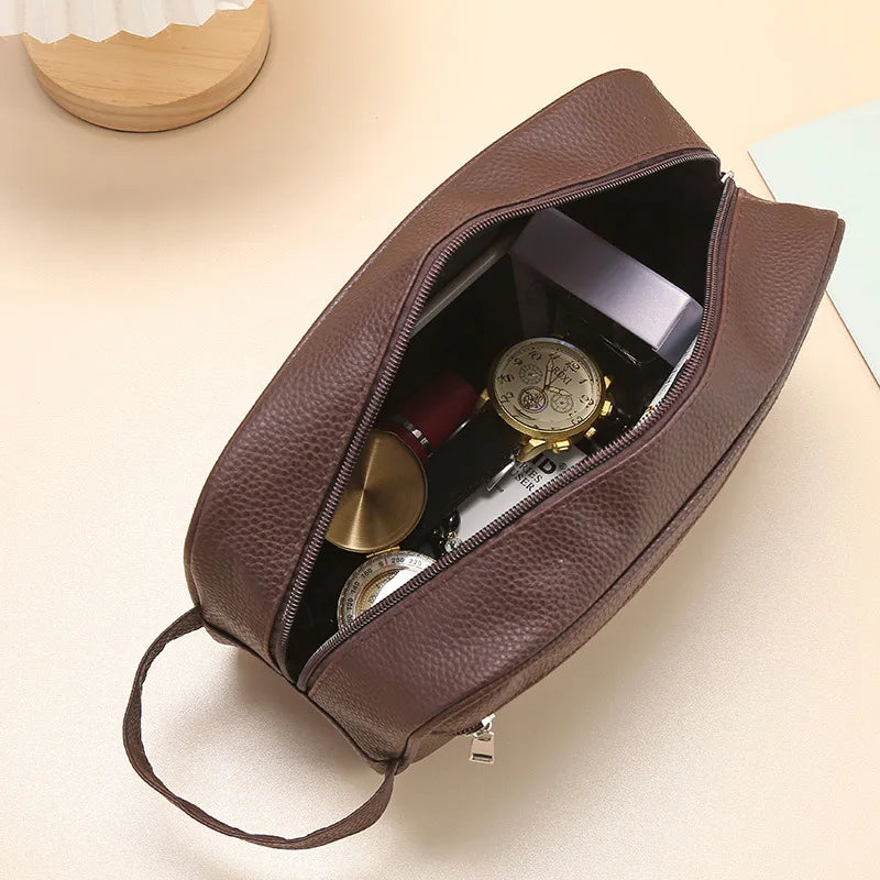 Anwen toiletry bag in brown, open showing pocketed interior