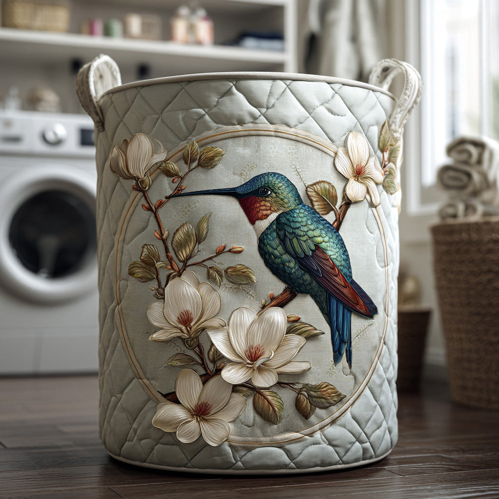 Diana hand-quilted laundry basket with hummingbird and magnolia motif in a laundry room