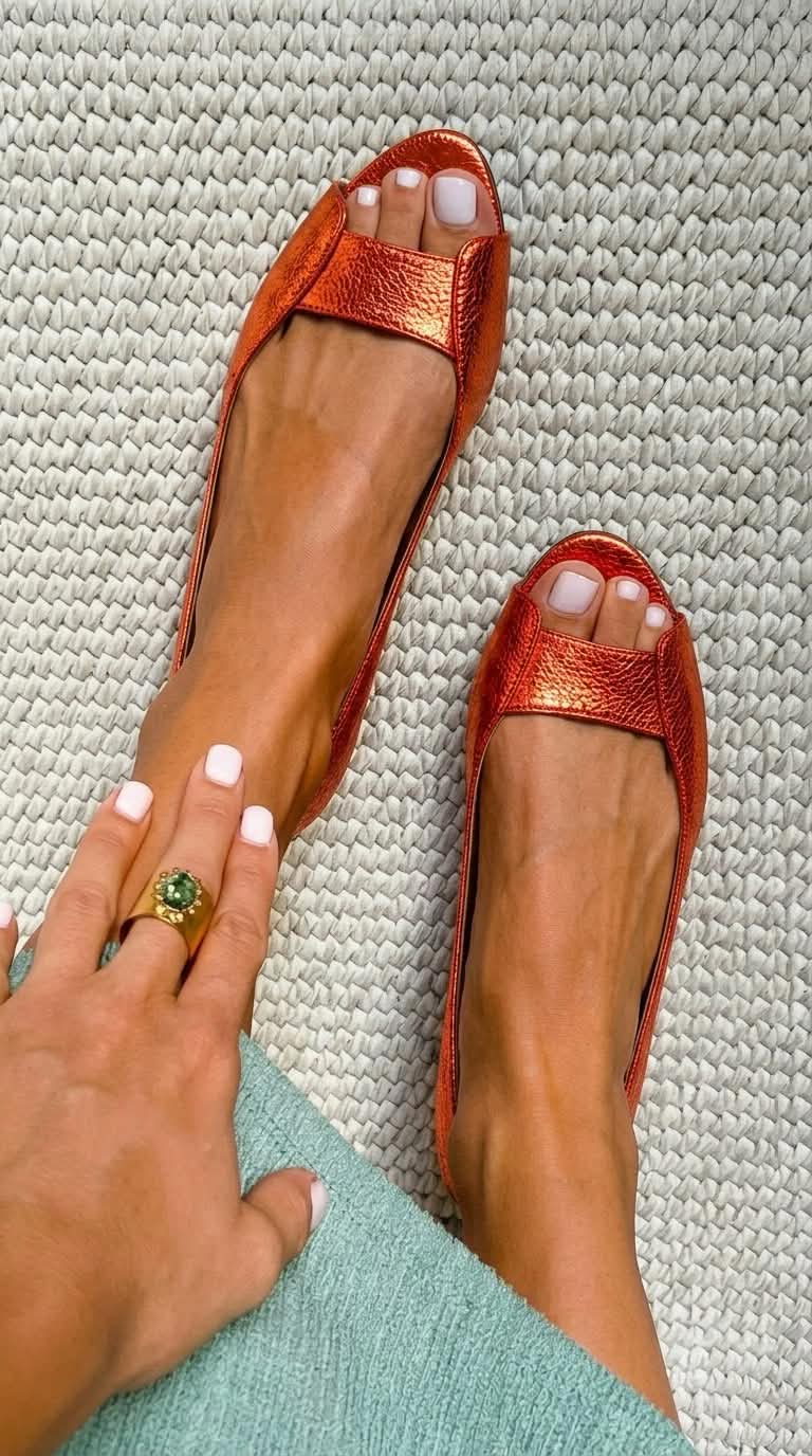 Adelina open-toe flat sandals in orange, overhead view