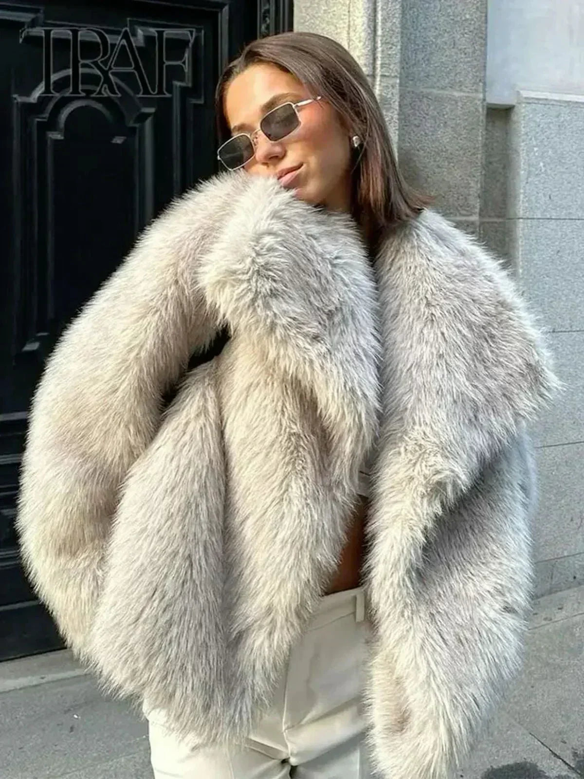 Fiorina faux fur jacket in grey, worn with oversized fur collar up
