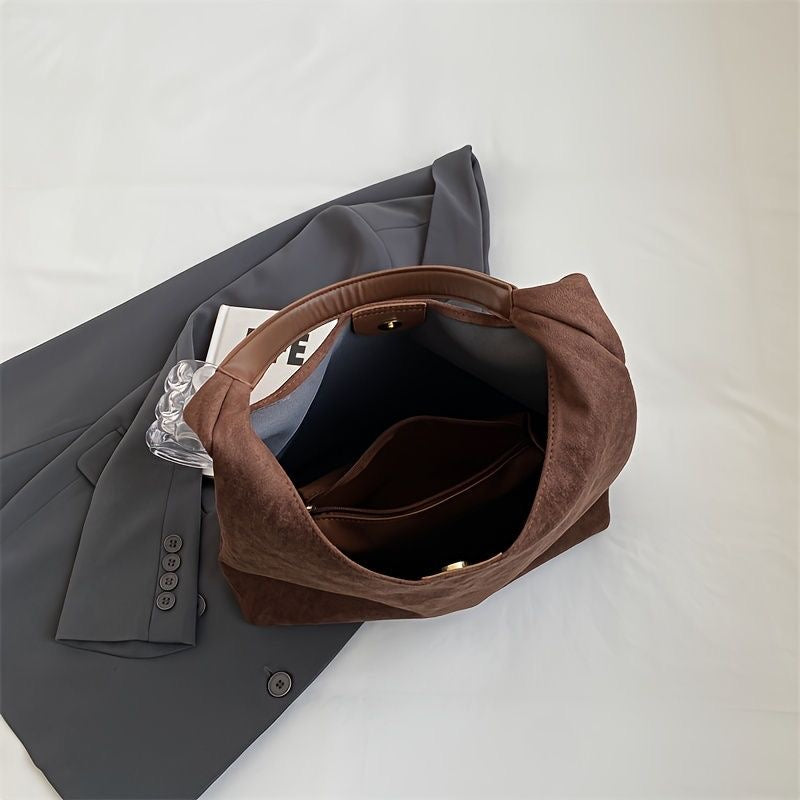 Ottilie shoulder bag interior showing deep compartment and pocket