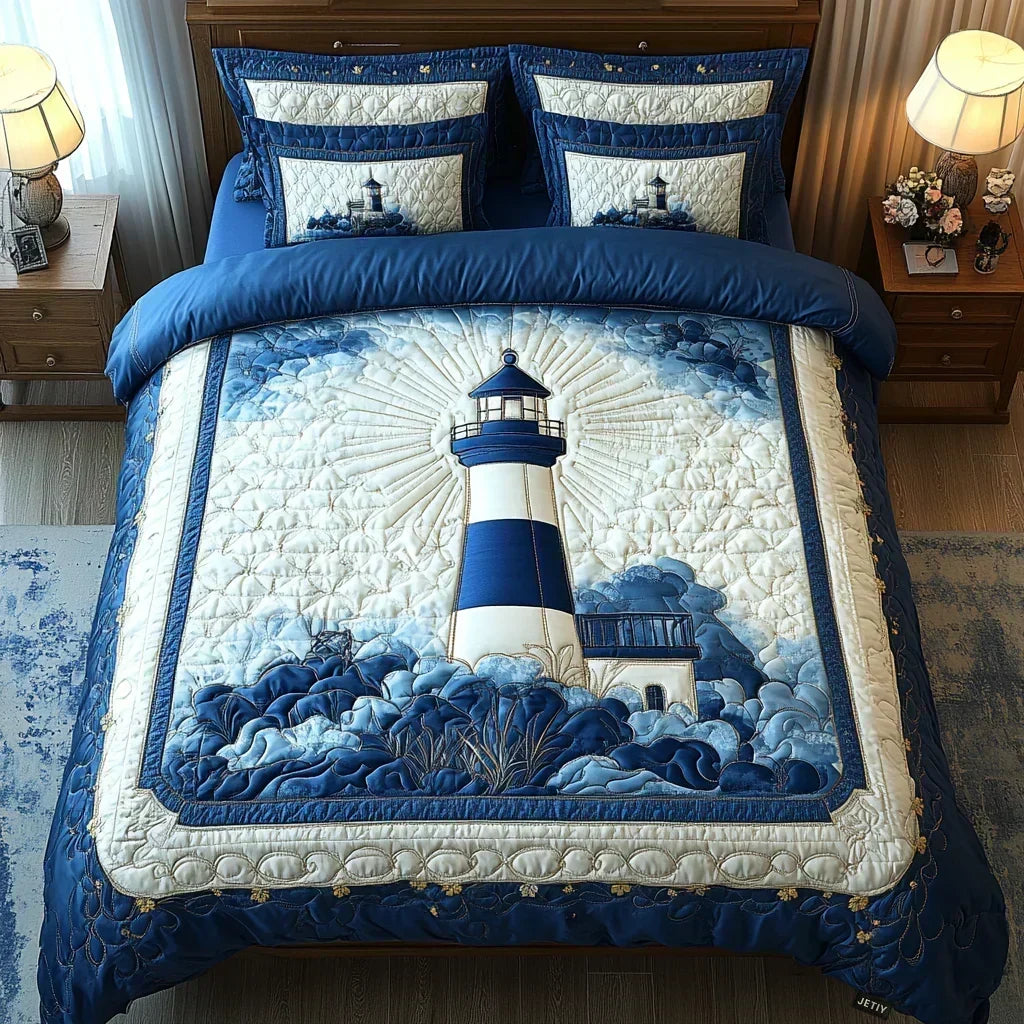 Lighthouse Breeze quilted bedding set in blue and cream with matching pillowcases on a bed