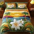 Aloha Spirit quilted bedding set with tropical palms, sunset and white flowers on a bed
