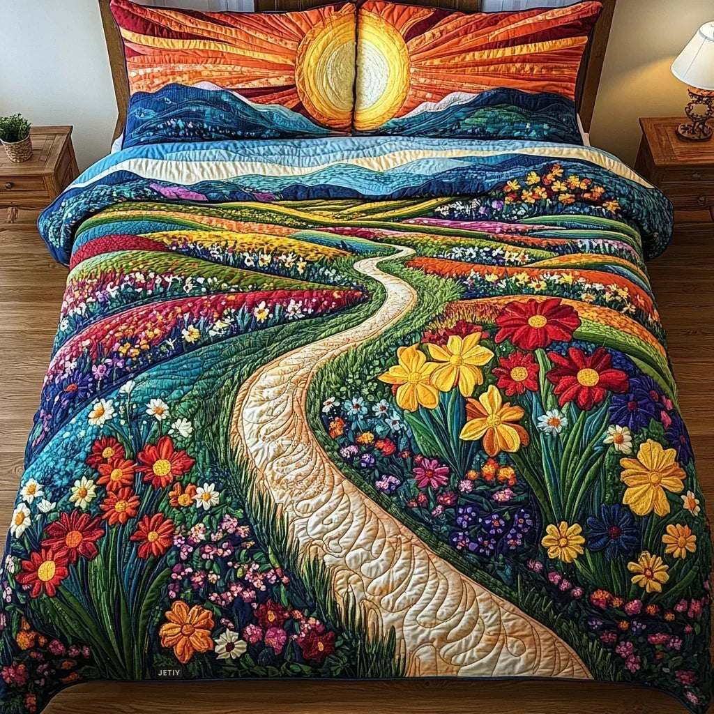 Ray of Sunshine quilted bedding set with sunrise, hills and flower meadow design on a bed