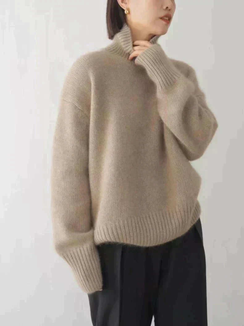Isaboll high-neck sweater in khaki, full front view with black trousers