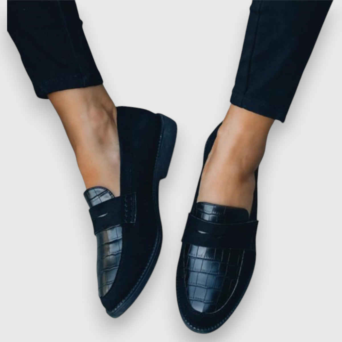 Juliette loafers in black with croc-textured strap, worn front view