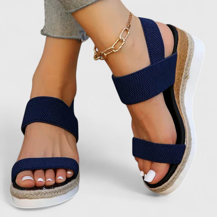 Merill orthopedic wedge sandals in navy, worn side view