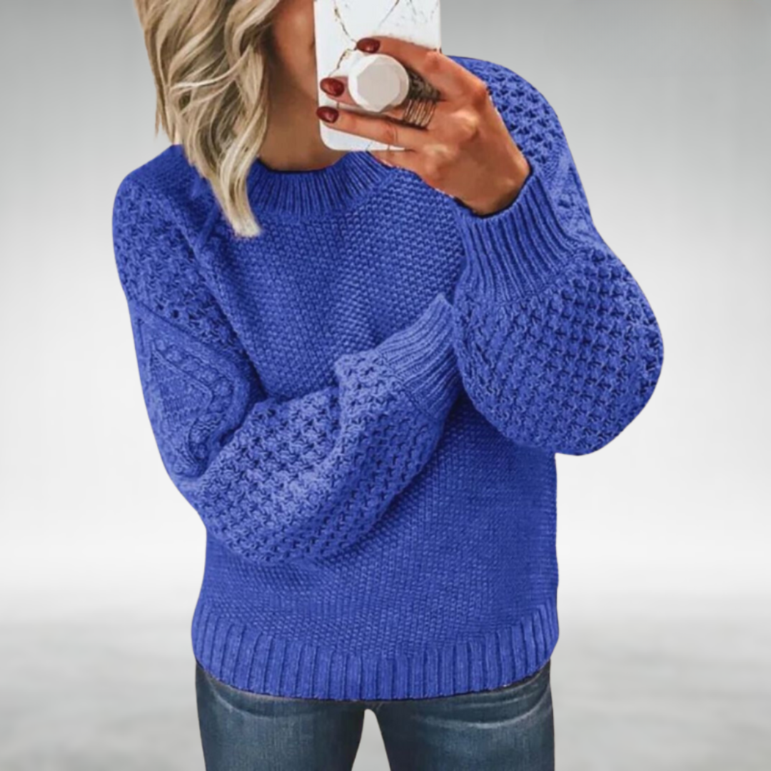 Calyra chic knit sweater in blue, front view worn with jeans