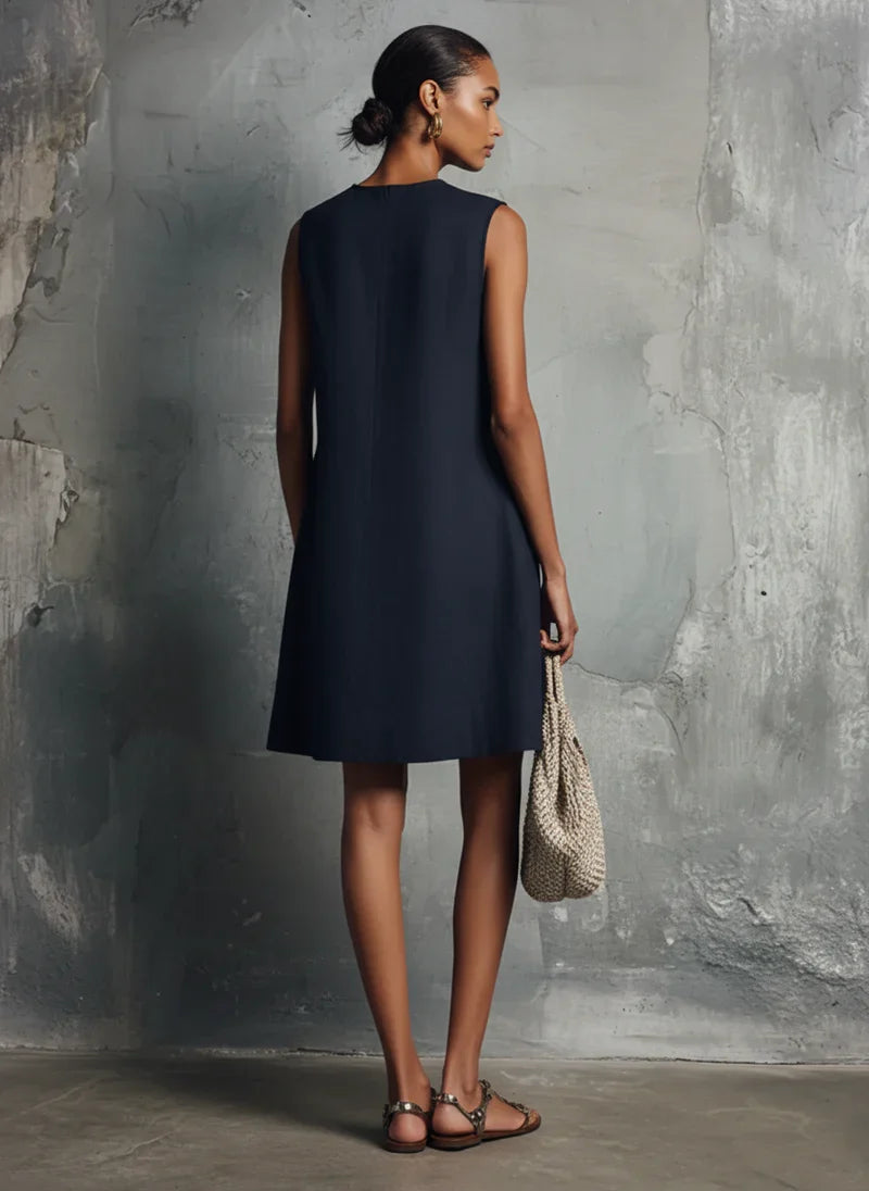 Aubrey navy mini dress, back view showing clean A-line shape