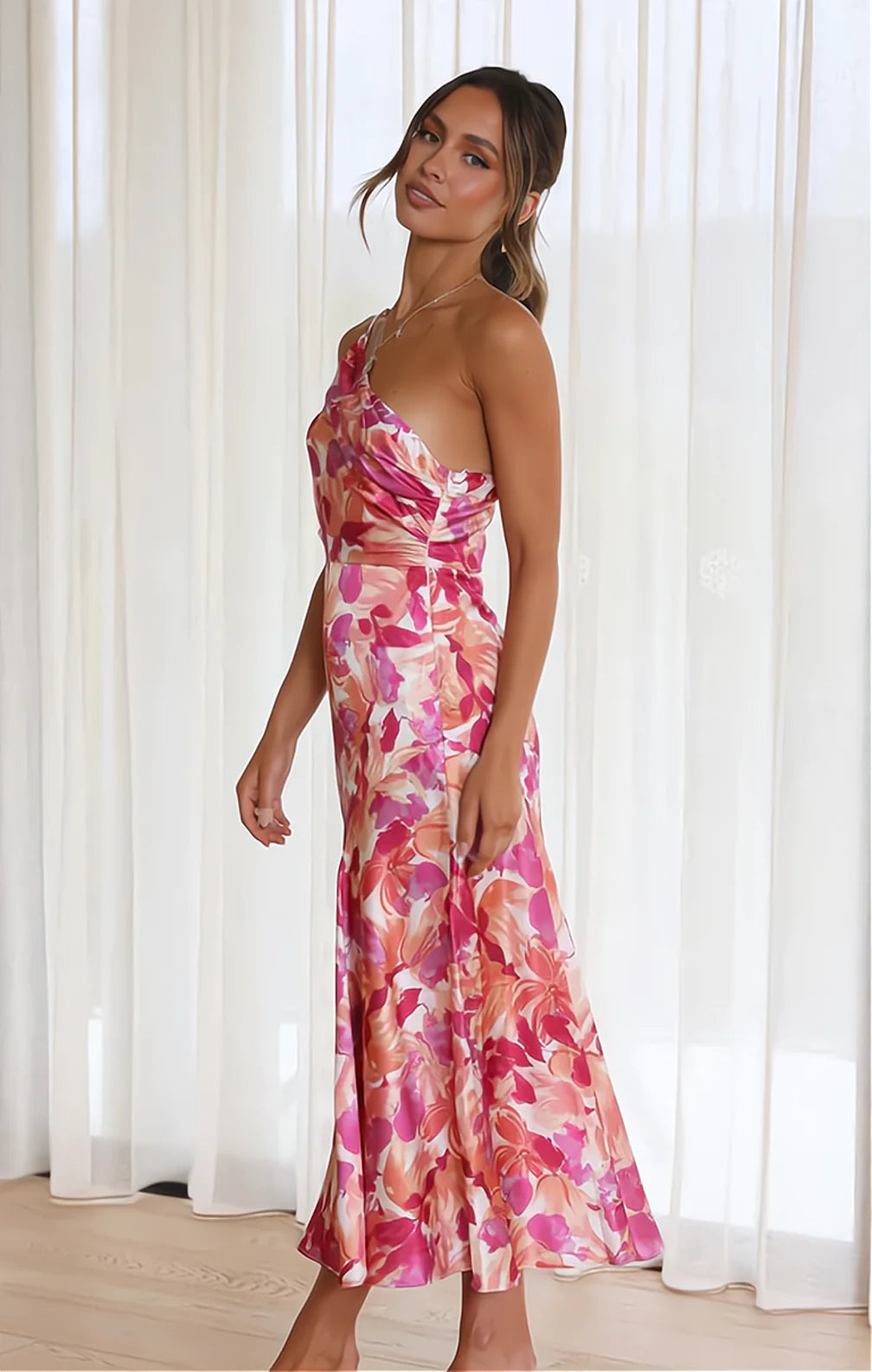Violet floral satin dress in pink, side view showing flared hem