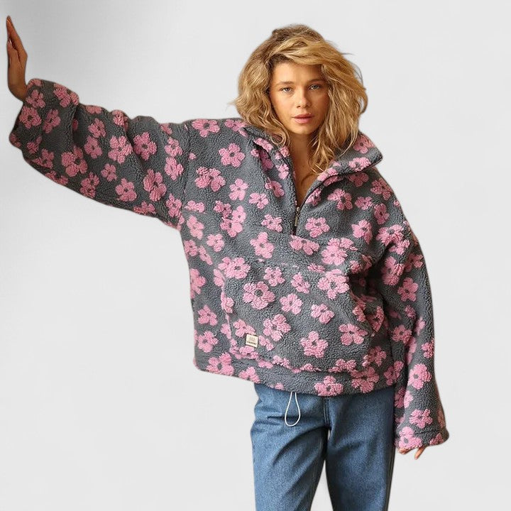 Delysanne sweater in grey with pink flowers, full front view with jeans