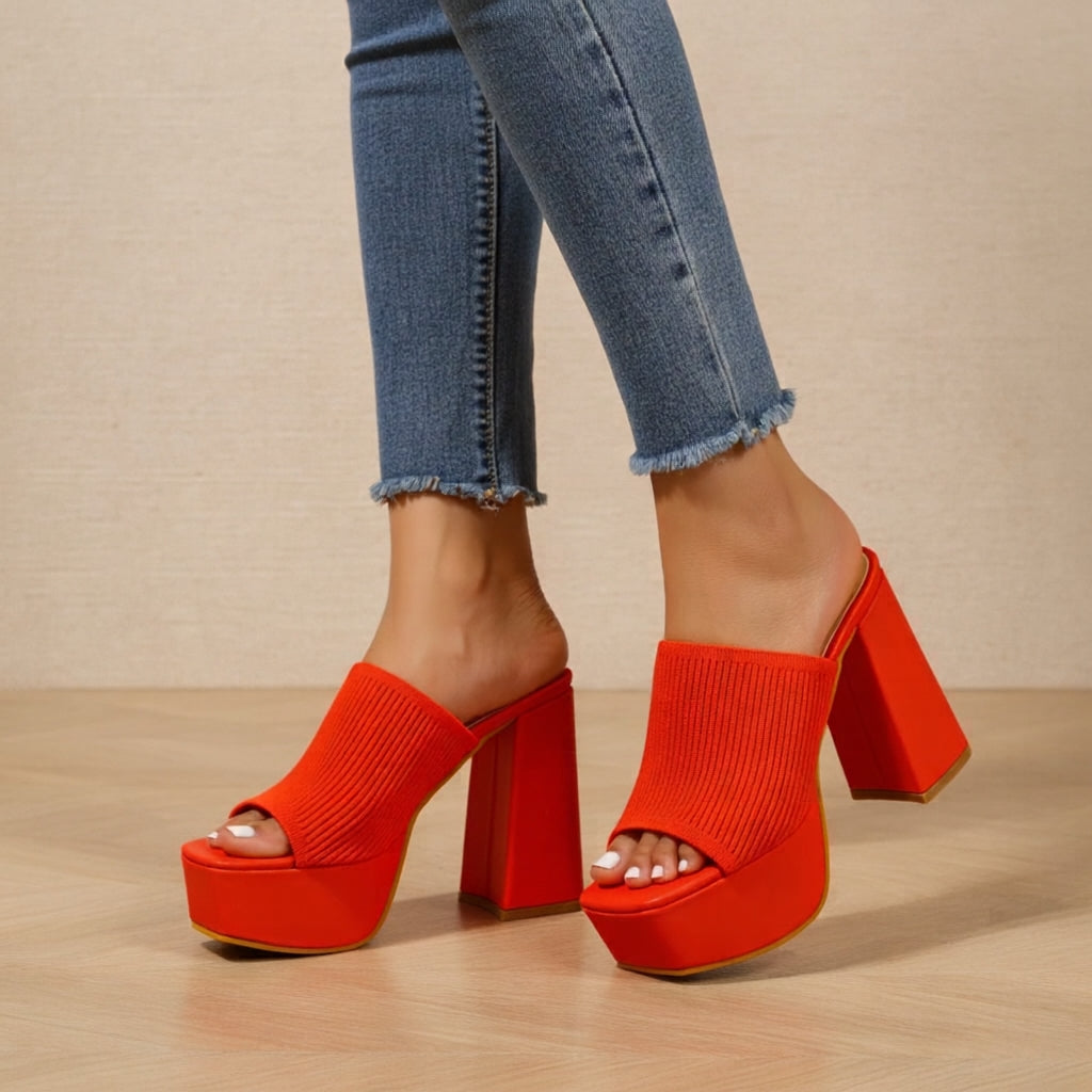 Helena platform sandals in orange worn with cropped jeans, front view