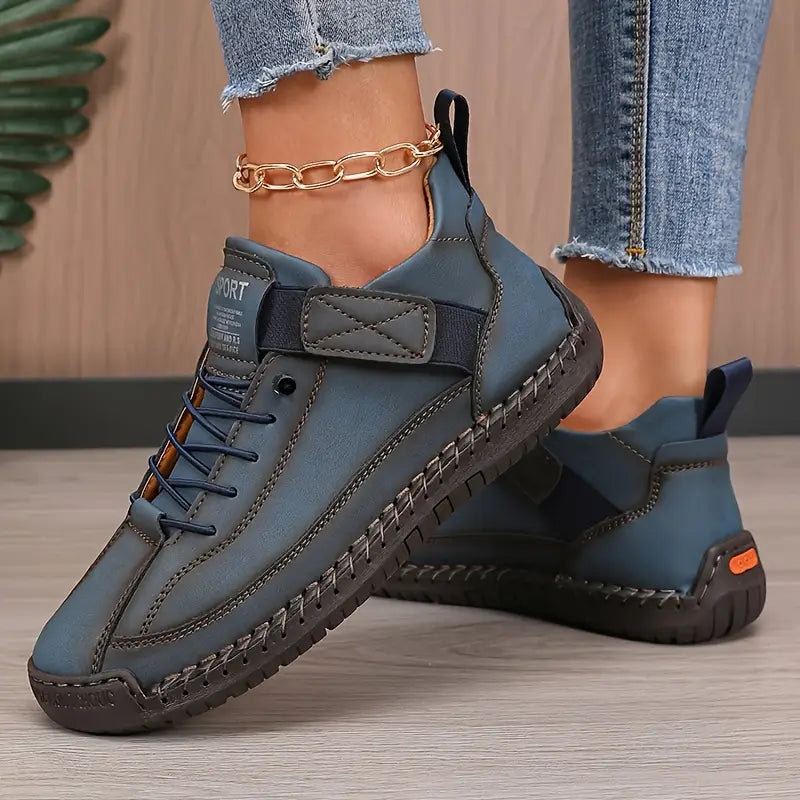 Mia orthopaedic trainers in blue, worn side view