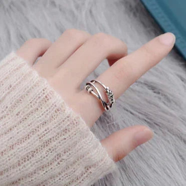 Tahlia stress-relief spinner ring in silver, worn on a model's hand