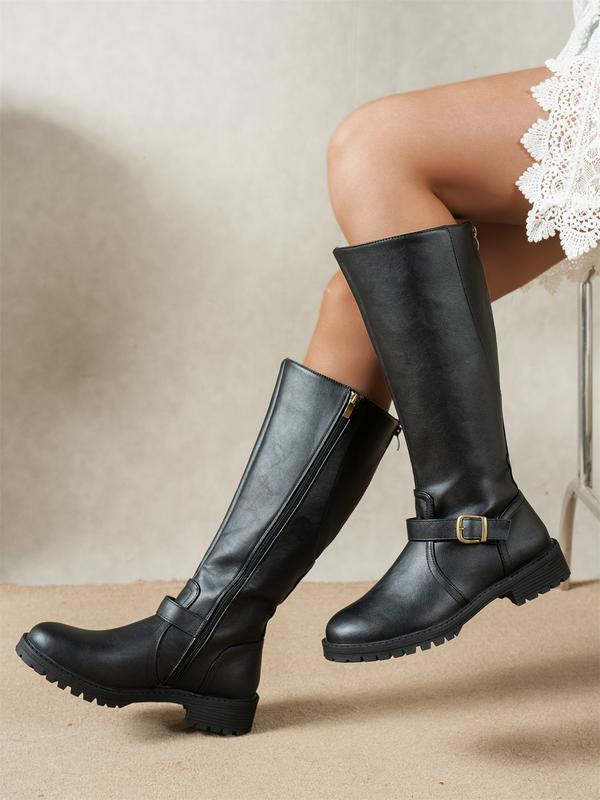 Vero orthopaedic knee-high boots in black, side view worn by model