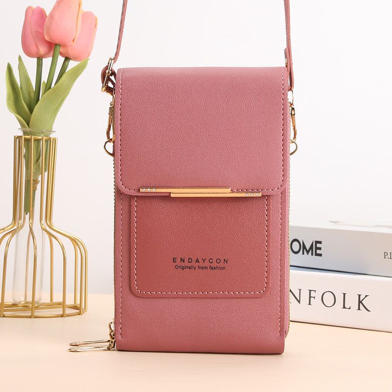 Eliza touch screen phone bag in pink, front view