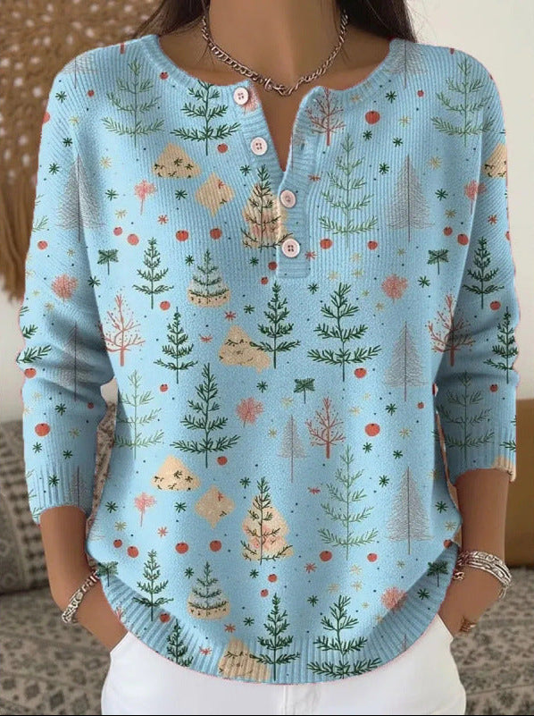 Madison festive sweater in winter blue with green tree print, front view