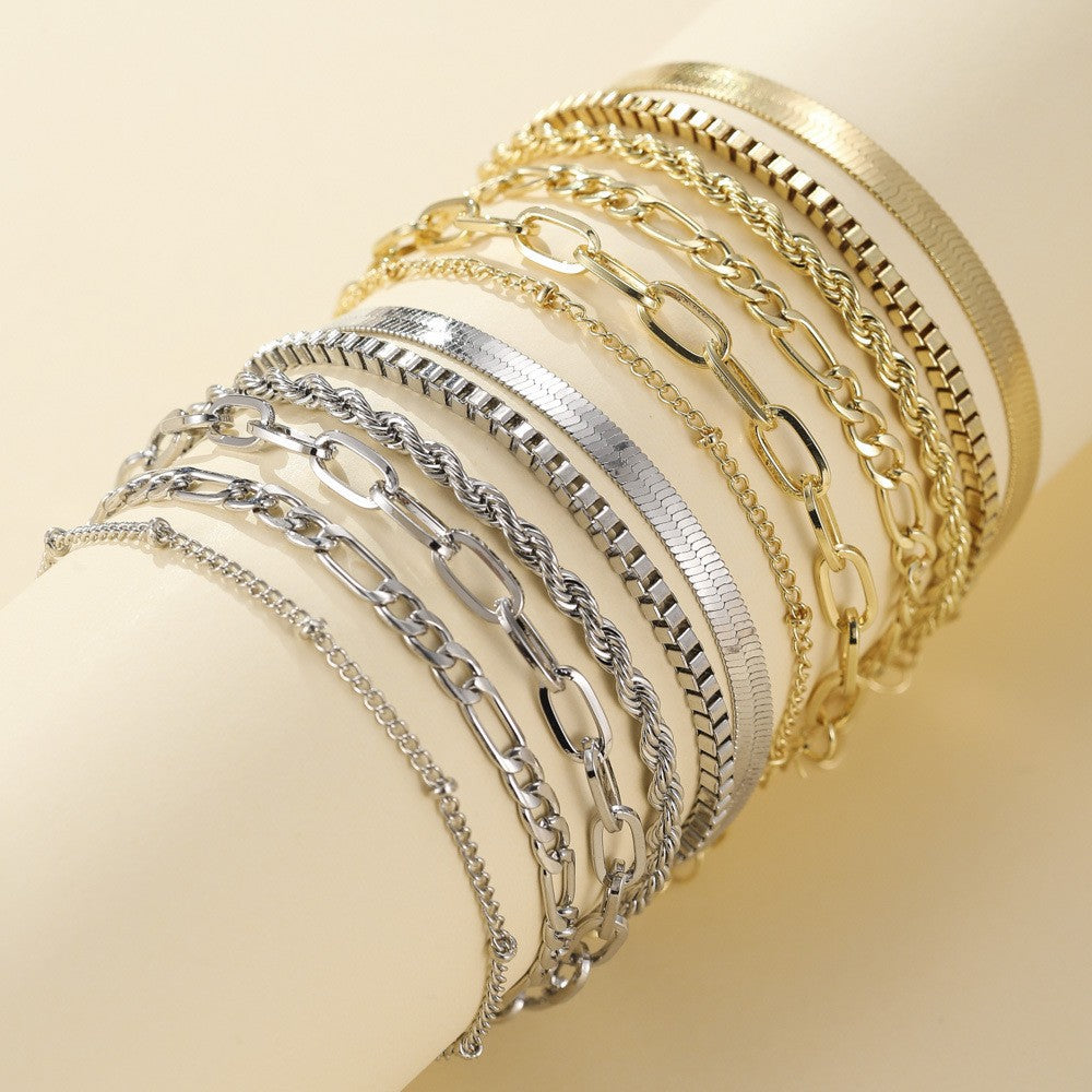 Juna bracelet set shown in gold and white gold on a display form