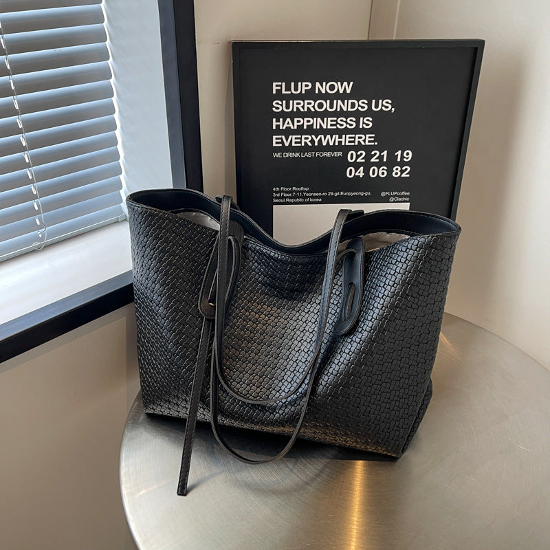 Arden woven tote bag in black, upright front view