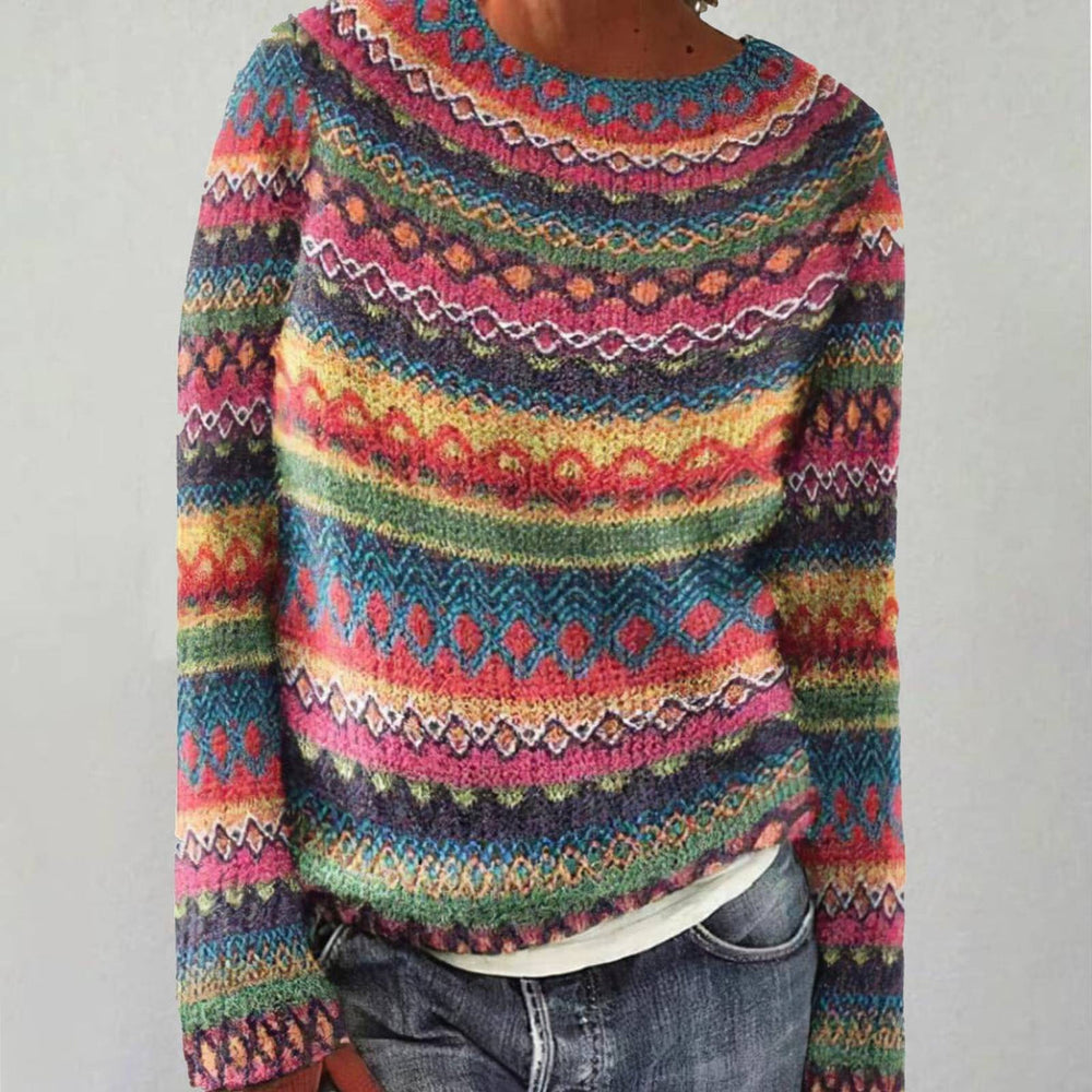 Aurora retro Scandinavian knitted sweater in multicoloured Nordic pattern, front view with jeans