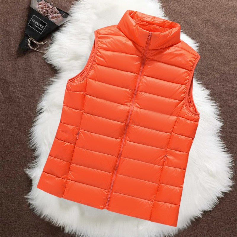 Isa padded gilet in orange, flat front view with stand collar and front zip