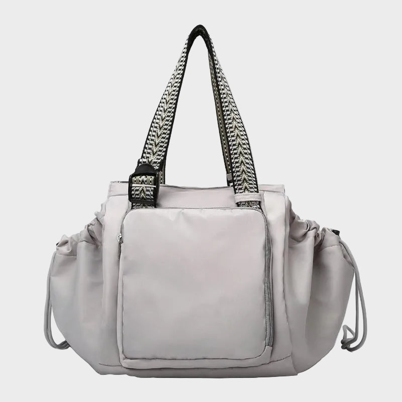 Ezra Pack Tote in grey with woven shoulder straps, front view