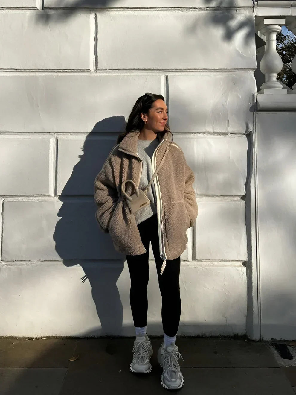 Araminta winter jacket in light brown worn with leggings, full-length street view