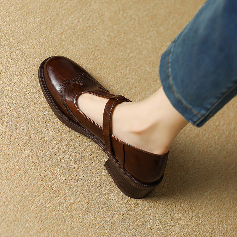 Ysolenne T-bar Mary Jane in brown, close-up of brogue toe detail