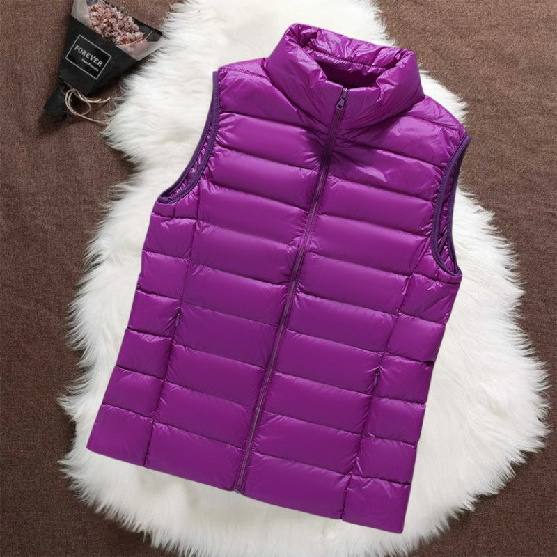 Isa padded gilet in purple, quilted sleeveless front view with stand collar