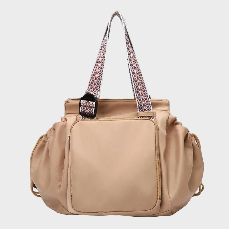 Ezra Pack Tote in khaki with drawstring side pockets, front view