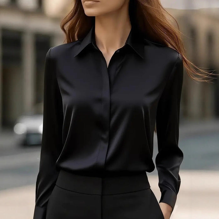 Luna elegant silk blouse in black, front view worn with tailored trousers